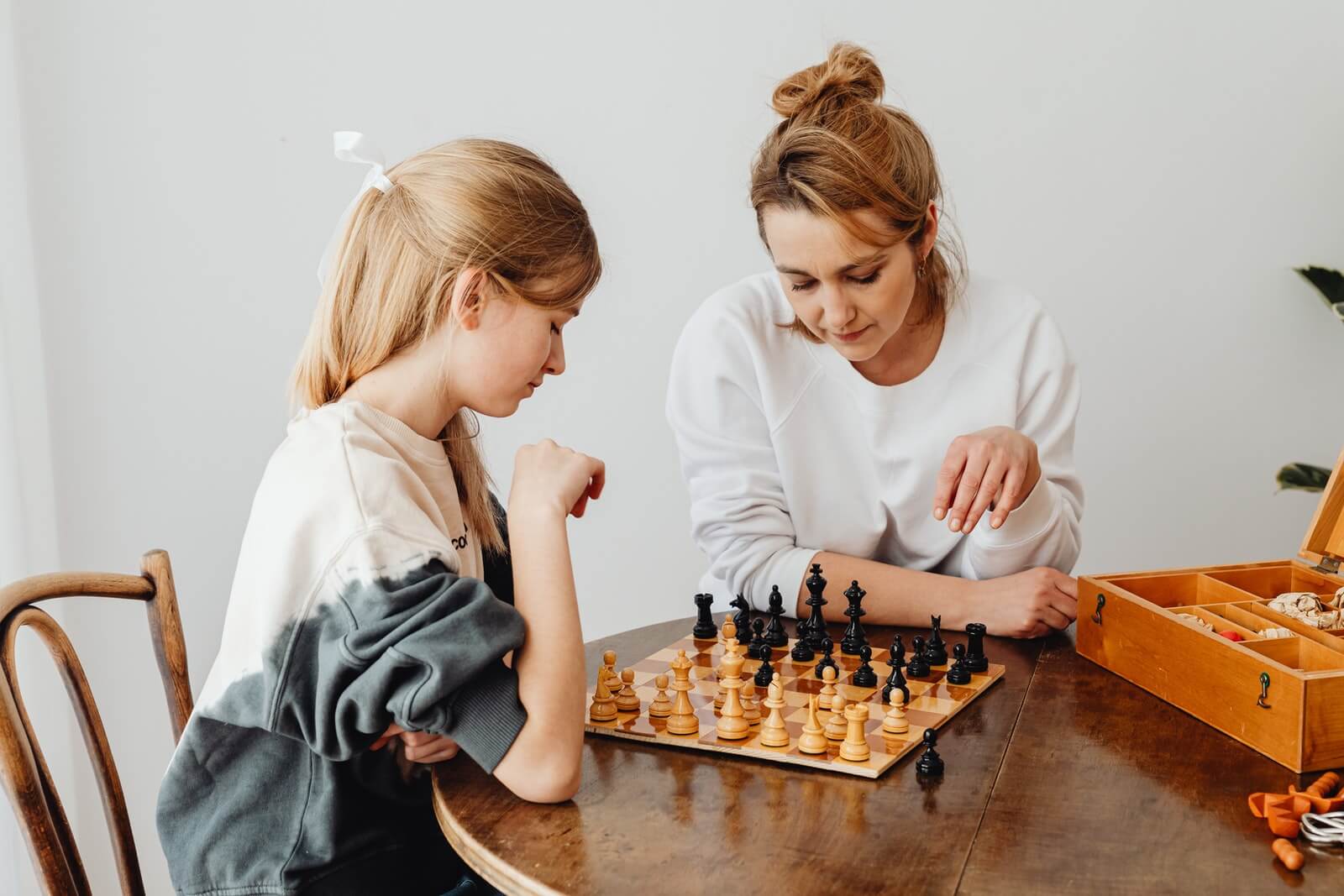Woman and a Girl Playing Chess
